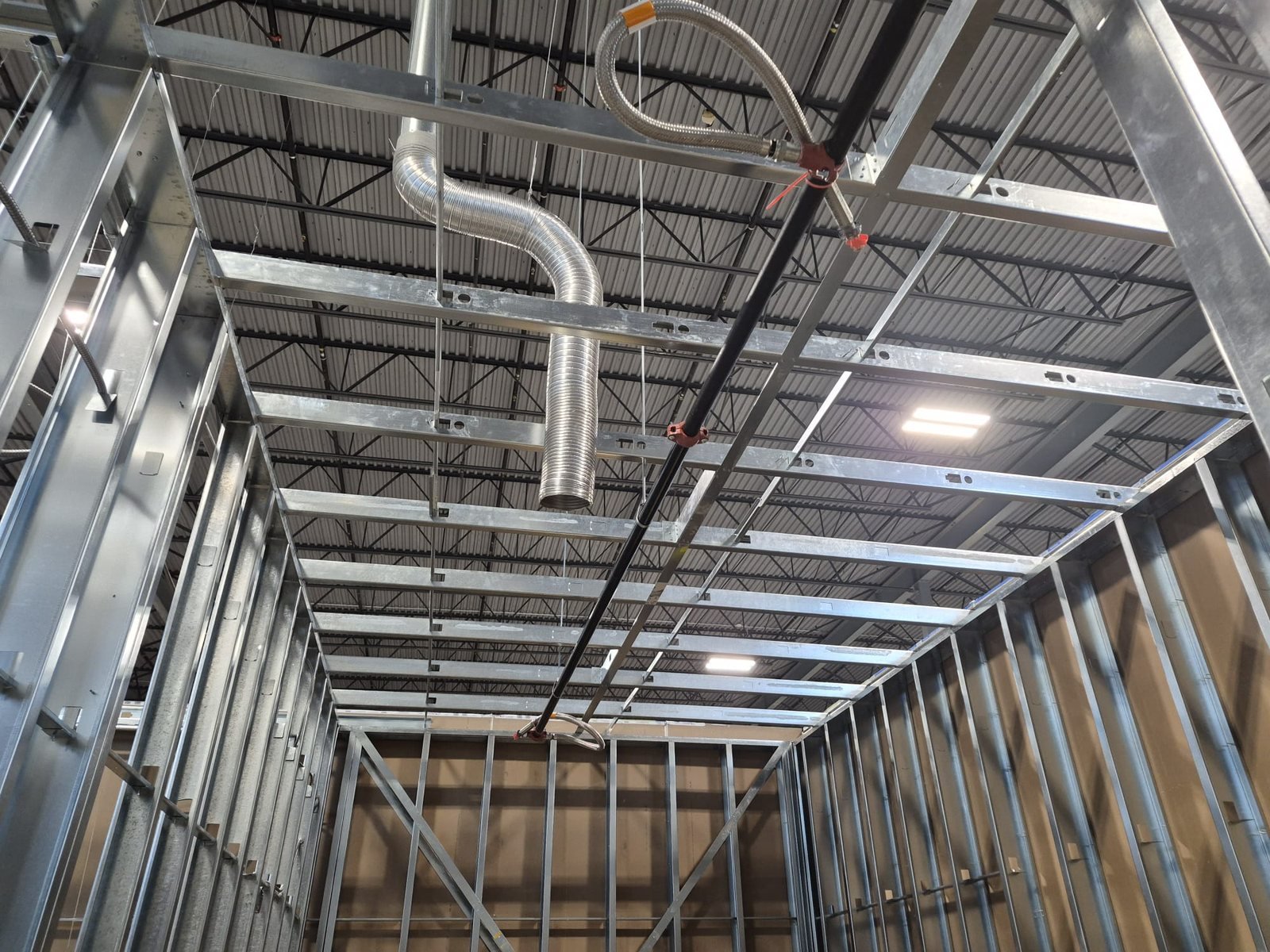 Steel stud framing inside a large warehouse